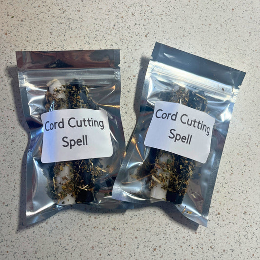 Two packages labeled 'Cord Cutting Spell' on a speckled surface.