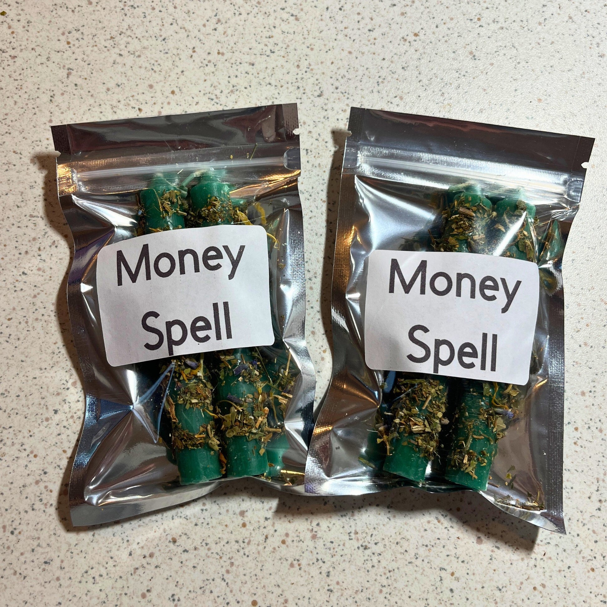 Two packages of dressed money candles